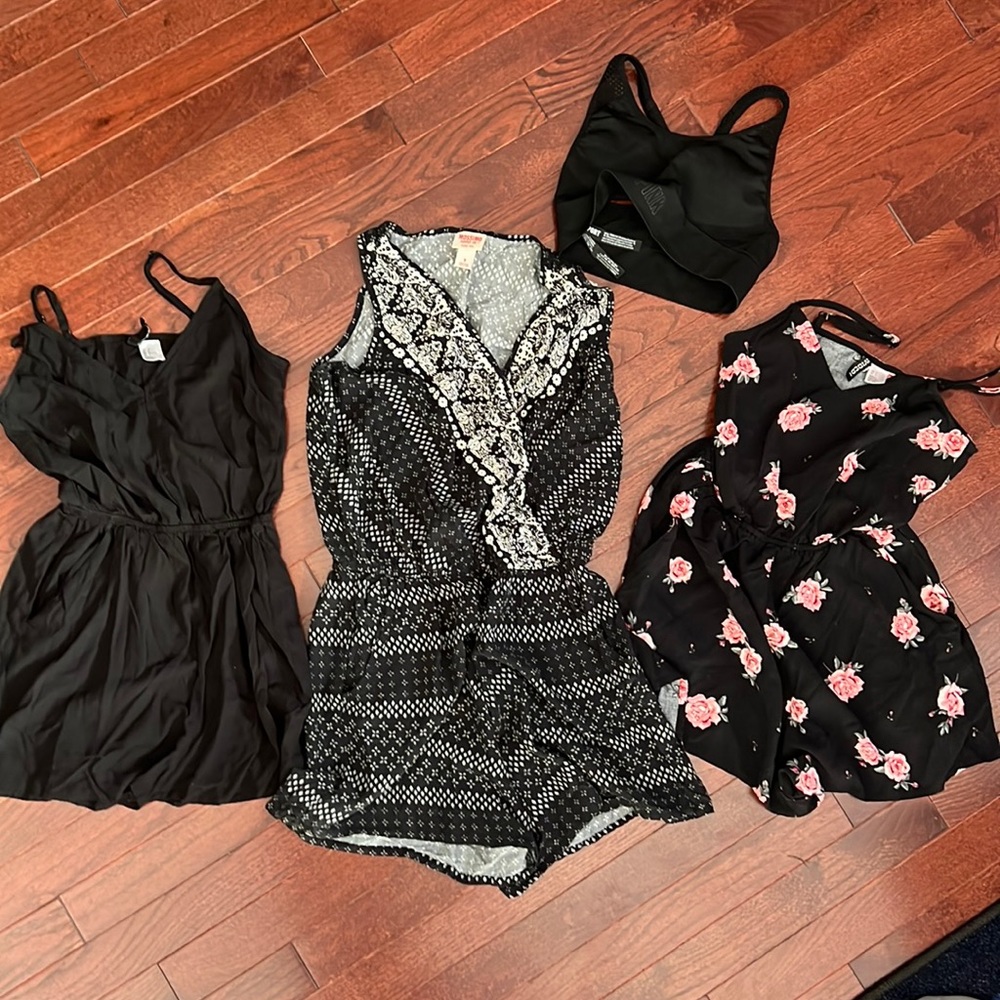 Three woman’s small rompers and one pink sports bra